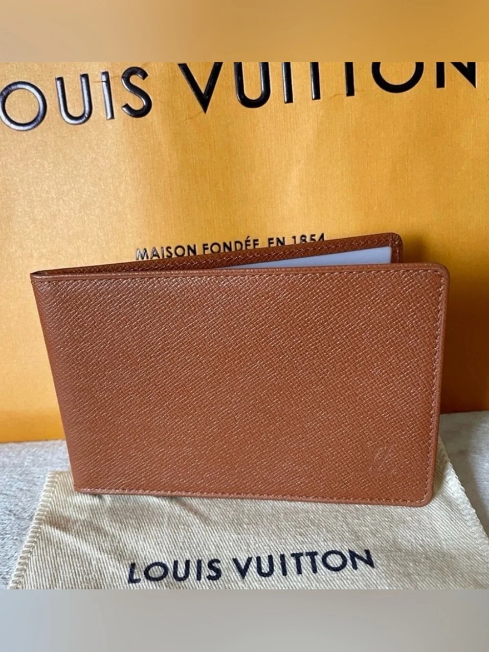 LOUIS VUITTON brown multiple bifold wallet in durable Taiga cross-grain leather